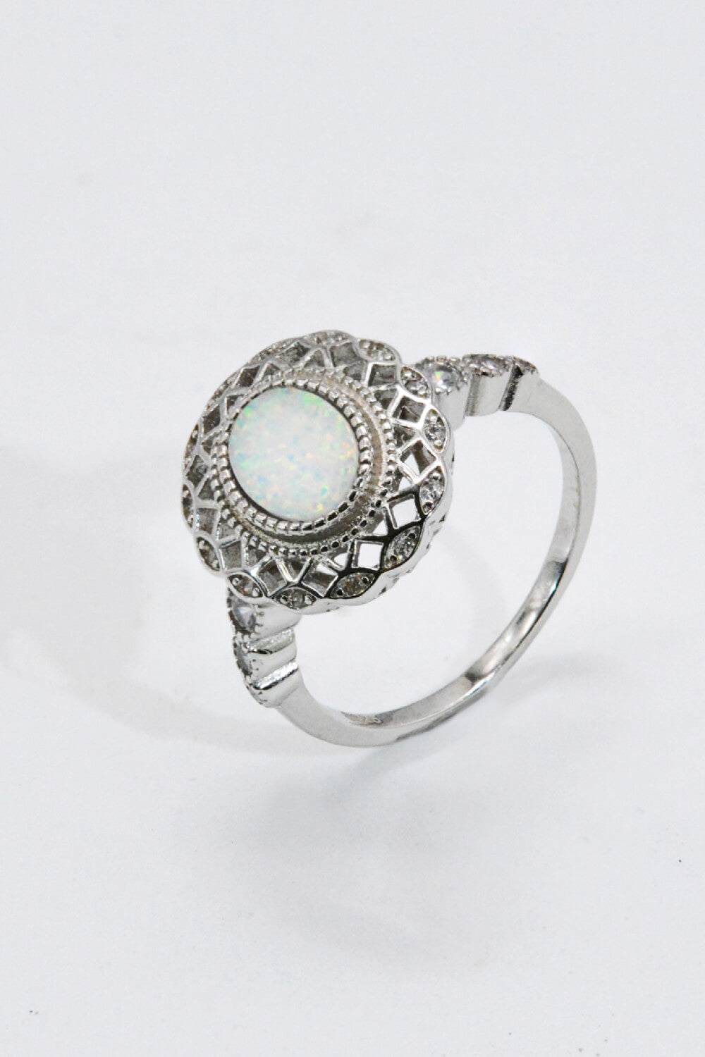 Feeling The Love 925 Sterling Silver Opal Ring displayed in a flat lay style, showcasing its minimalist design and opal stone.